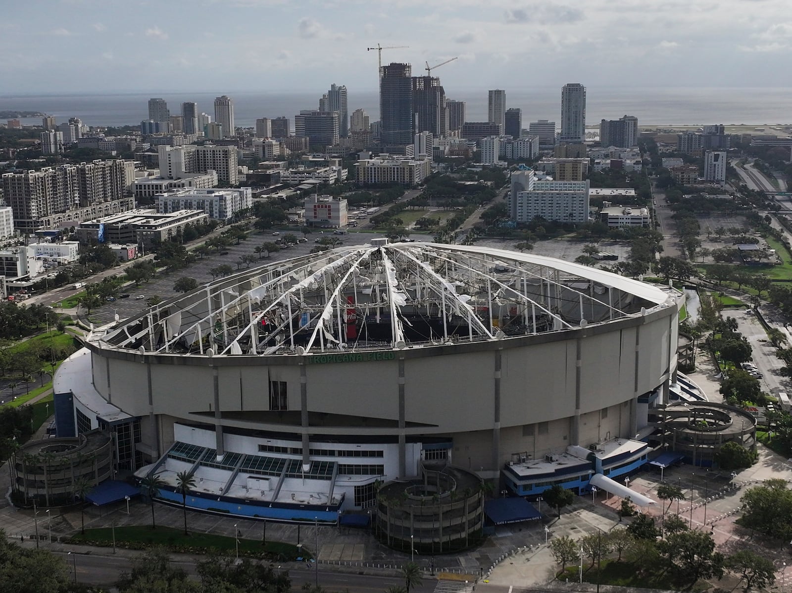 An aerial drone view shows Tropicana Field with the roof damaged after Hurricane Milton in downtown St. Petersburg, Fla., on Thursday, Oct. 10, 2024. (Dirk Shadd/Tampa Bay Times via AP)