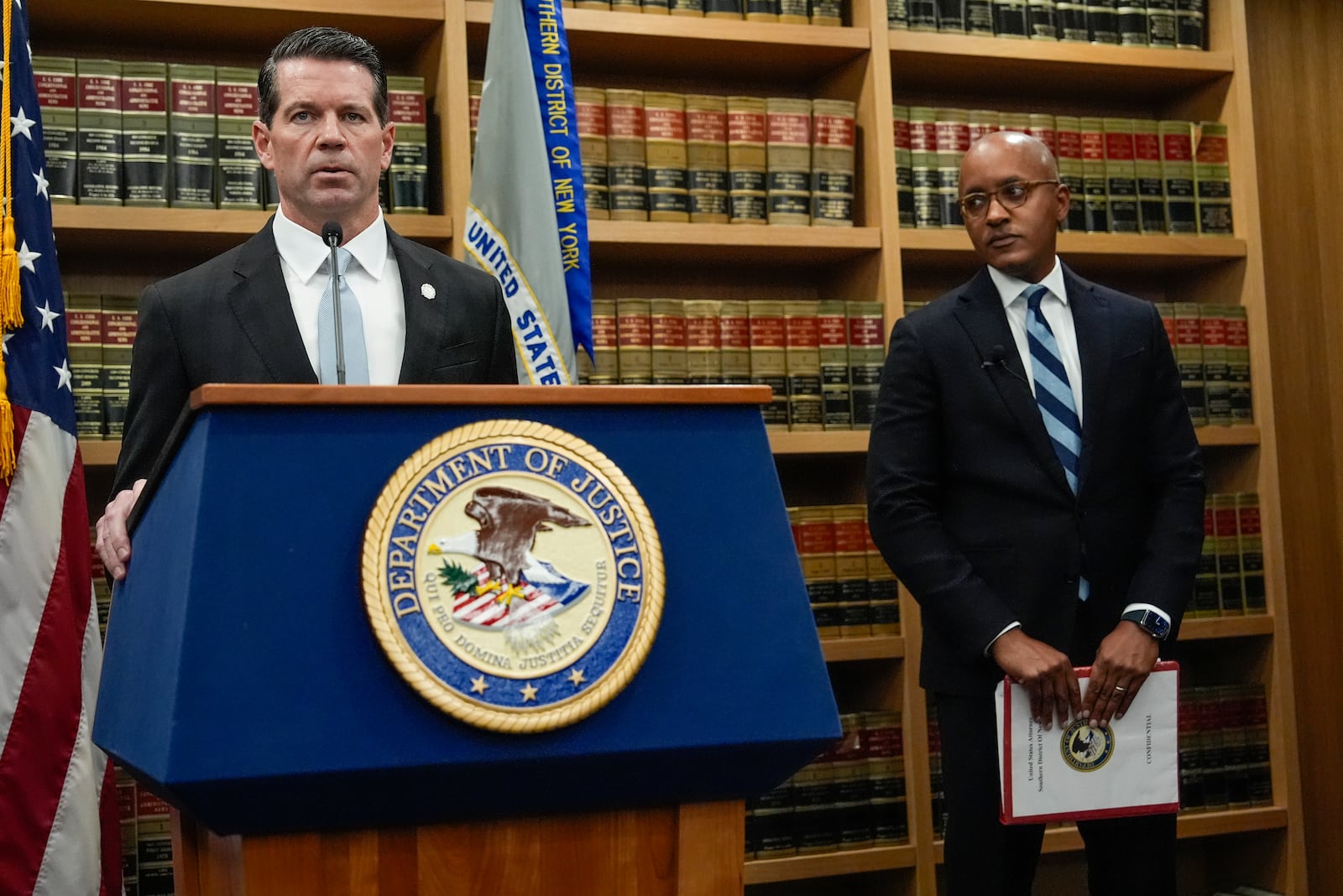 James Dennehy, FBI New York Assistant Director in Charge, left, speaks at a news conference detailing an indictment against New York City Mayor Eric Adams as U.S. Attorney Damian Williams looks on, Thursday, Sept. 26, 2024, in New York. (AP Photo/Julia Demaree Nikhinson)