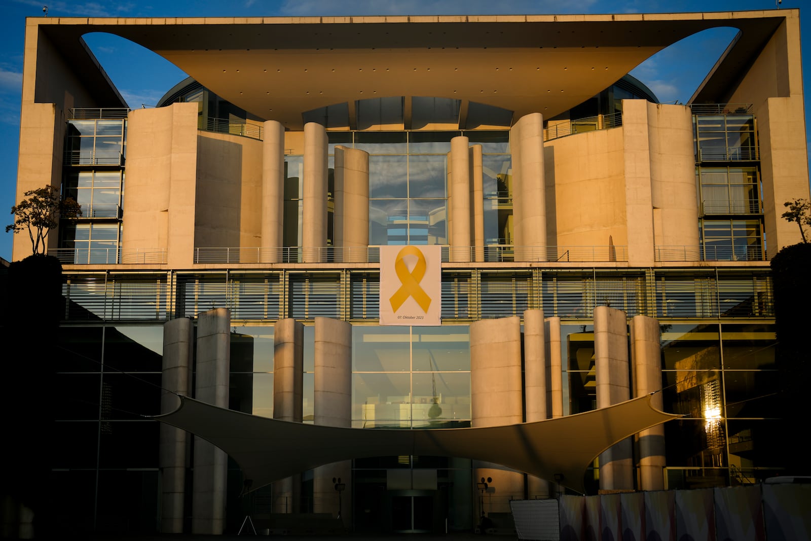 A Yellow Ribbon displayed as the facade of the German Chancellor to show solidarity with Israel marking the first anniversary of the Hamas spearheaded attacks on Israel, in Berlin, Germany, Monday, Oct. 7, 2024. (AP Photo/Markus Schreiber)