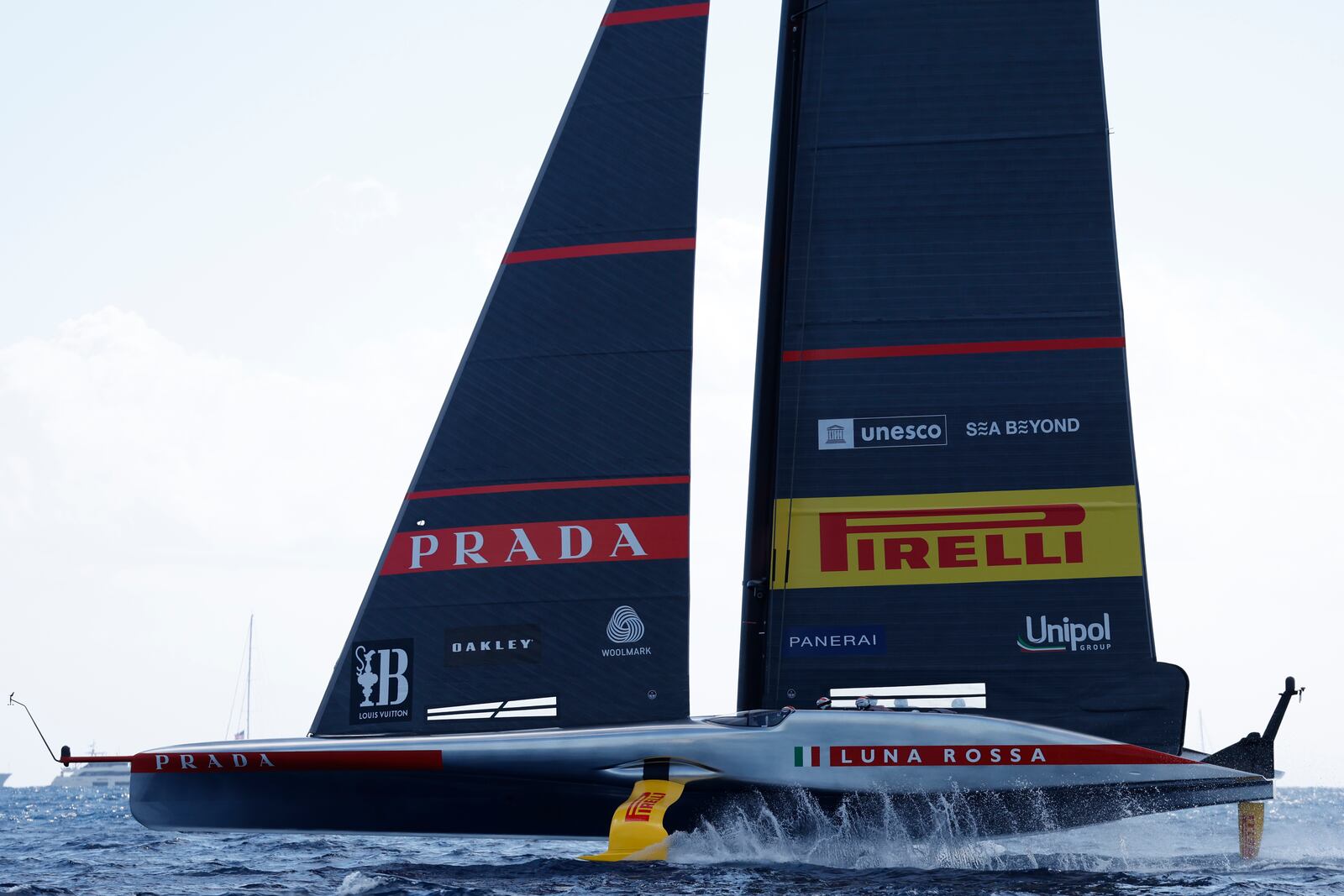 Luna Rosa Prada Pirelli sailing team competes during the Louis Vuitton Cup Final Day 7 at the Barcelona's coast, Spain, Friday, Oct. 4, 2024. (AP Photo/Joan Monfort)