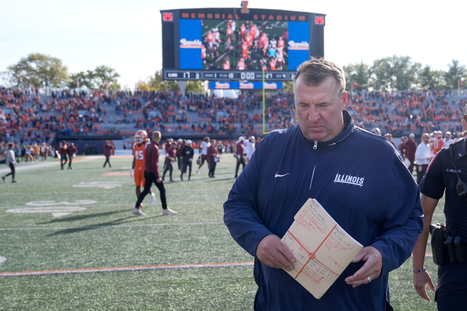 Illinois head coach Bret Bielema walks off the field after his team's 25-17 loss to Minnesota in an NCAA college football game Saturday, Nov. 2, 2024, in Champaign, Ill. (AP Photo/Charles Rex Arbogast)