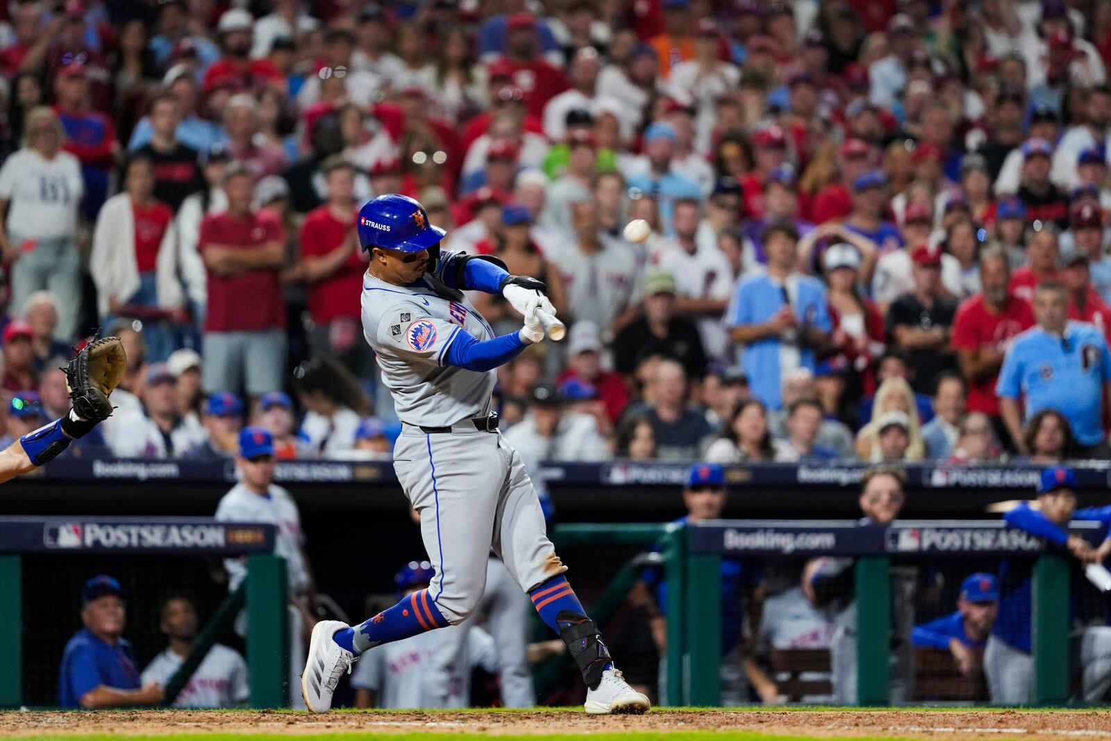 New York Mets' Mark Vientos hits a two-run home run against Philadelphia Phillies pitcher Matt Strahm during the ninth inning of Game 2 of a baseball NL Division Series, Sunday, Oct. 6, 2024, in Philadelphia. (AP Photo/Matt Slocum)