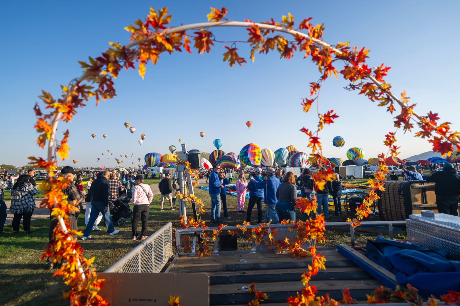 Spectators watch as hot air balloons take off during the mass ascension at the 52nd Albuquerque International Balloon Fiesta in Albuquerque, N.M., on Saturday, Oct. 5, 2024. (AP Photo/Roberto E. Rosales)