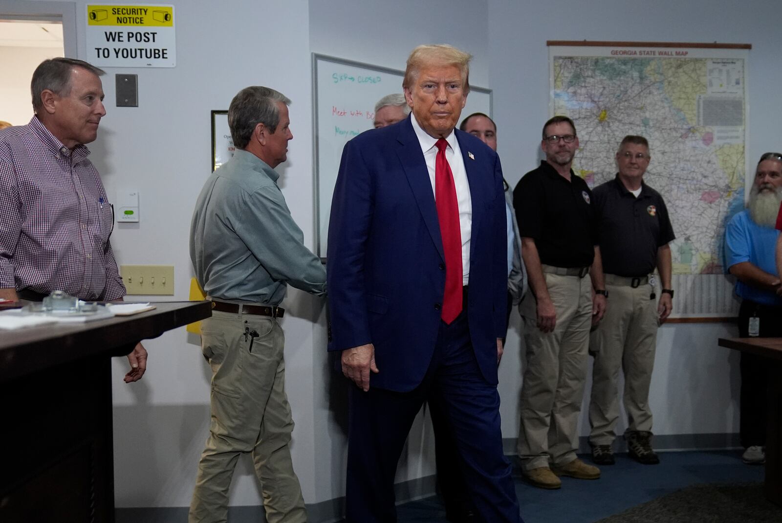 Republican presidential nominee former President Donald Trump arrives for a briefing at the Columbia County Emergency Management Agency as he visits areas impacted by Hurricane Helene, Friday, Oct. 4, 2024, in Evans, Ga. (AP Photo/Evan Vucci)