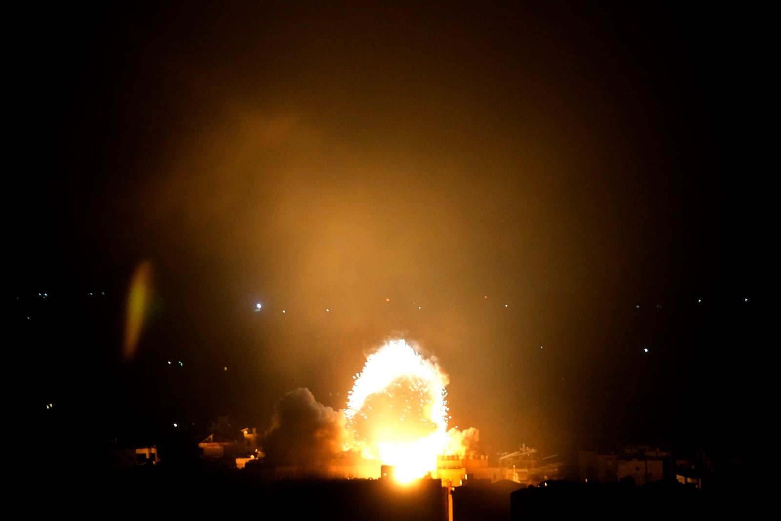 Flames and smoke rise from an Israeli airstrike in Dahiyeh, Beirut, Lebanon, early Sunday, Oct. 6, 2024. (AP Photo/Hussein Malla)