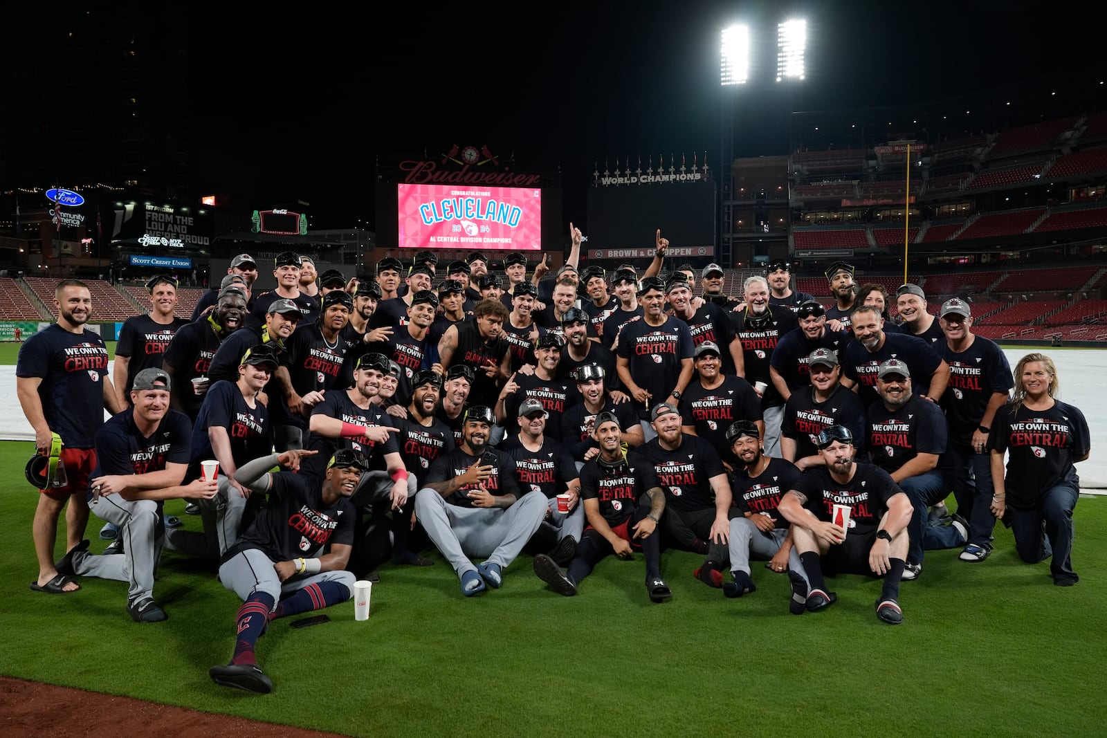 Members of the Cleveland Guardians pose for a group photo after winning the American League Central following a baseball game against the St. Louis Cardinals Saturday, Sept. 21, 2024, in St. Louis. (AP Photo/Jeff Roberson)