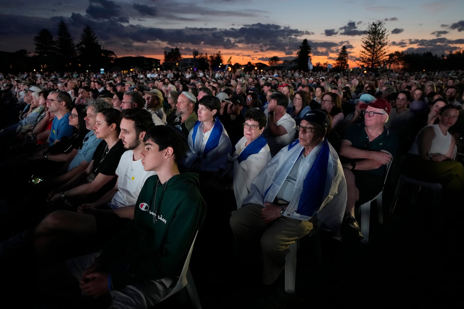 Members of the Jewish community gather at a park in Sydney, Australia, on Monday, Oct. 7, 2024, as mourners marked the anniversary of the Oct. 7, 2023, attack. (AP Photo/Rick Rycroft)