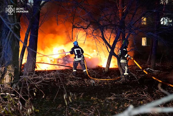 In this photo provided by the Ukrainian Emergency Service, firefighters extinguish the fire following a Russian rocket attack that hit a multi-storey apartment building in Sumy, Ukraine, Sunday, Nov. 17, 2024. (Ukrainian Emergency Service via AP)