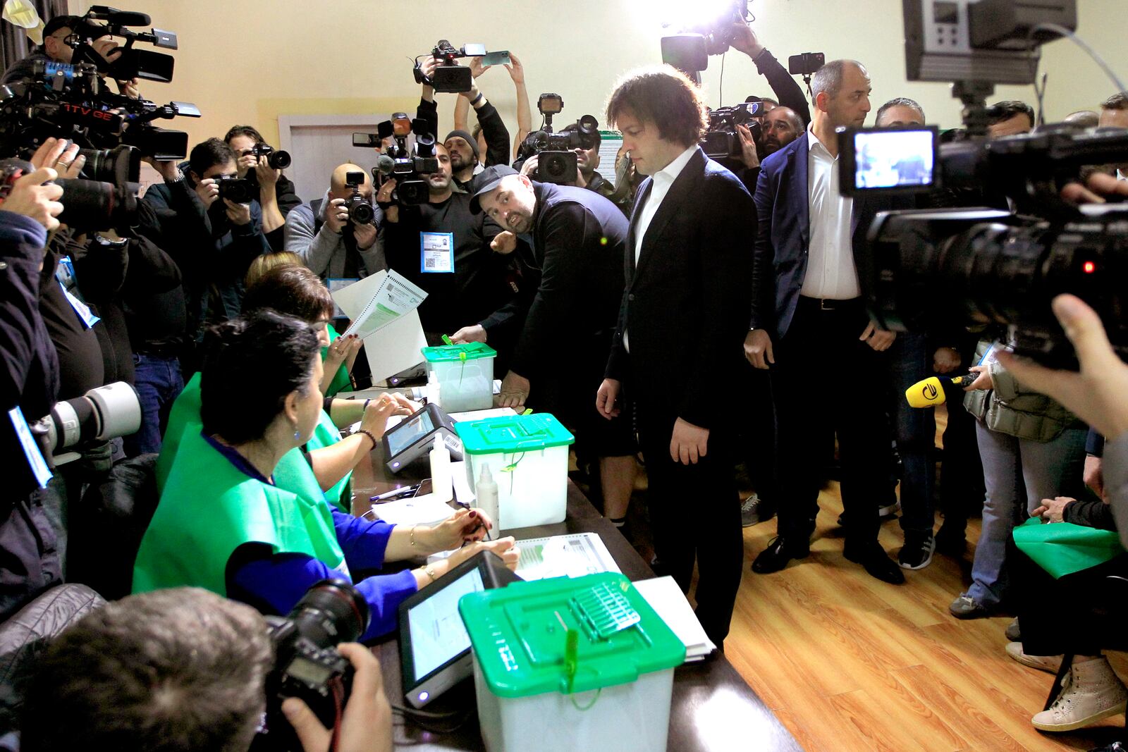 Georgian Prime Minister Irakli Kobakhidze gets his ballot at a polling station during the parliamentary election in Tbilisi, Georgia, Saturday, Oct. 26, 2024. (AP Photo/Shakh Aivazov)