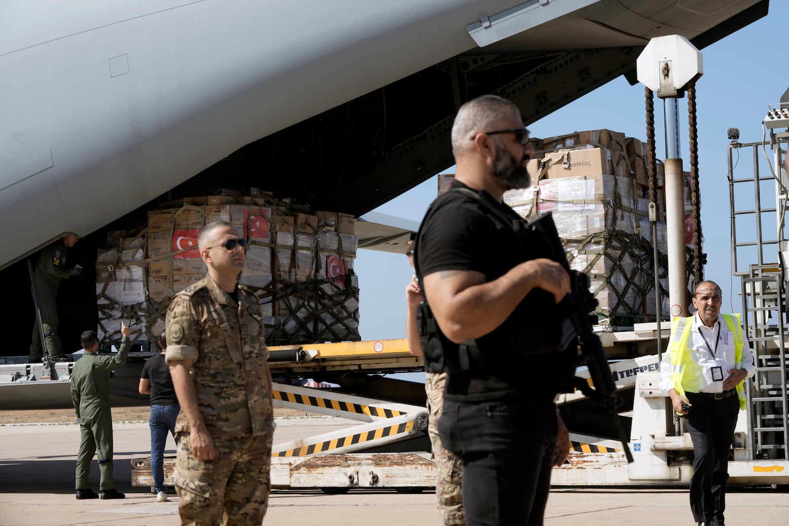 A Turkish Air Force airplane brings medical aid boxes at Beirut International airport, Wednesday, Sept. 25, 2024. (AP Photo/Bilal Hussein)