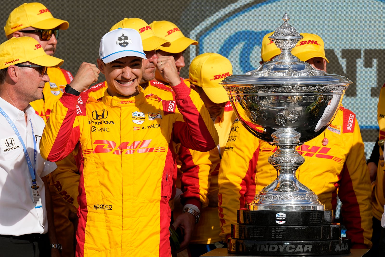 Alex Palou, second from front left, celebrates after winning his third IndyCar championship in four years Sunday, Sept. 15, 2024, at Nashville Superspeedway in Lebanon, Tenn. (AP Photo/Mark Humphrey)