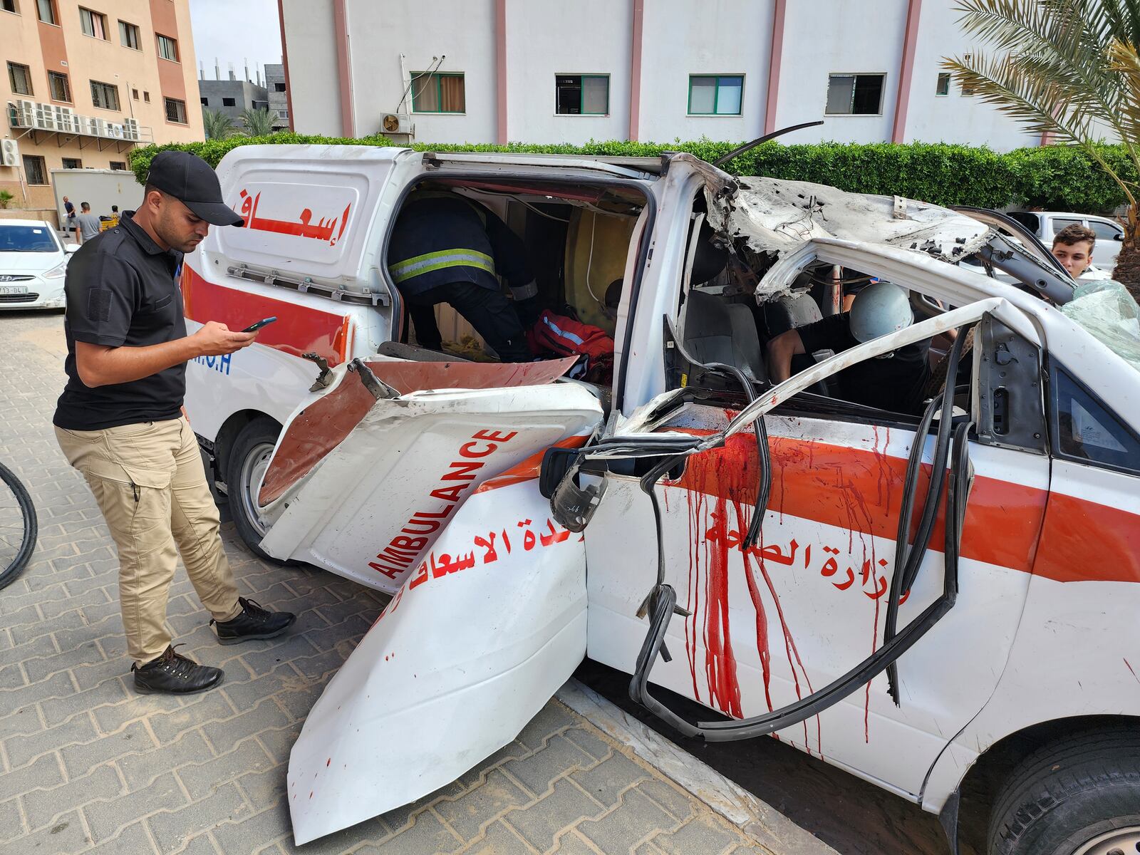 FILE - Palestinian medics inspect a damaged Ambulance hit by an Israeli air strike inside Nasser Hospital in Khan Younis, southern Gaza Strip, Saturday, Oct. 7, 2023. (AP Photo, File)