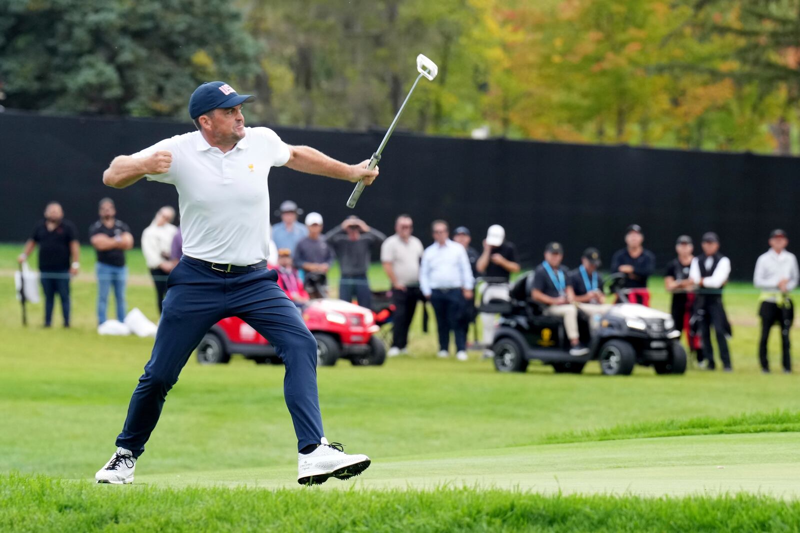 United States team member Keegan Bradley reacts after a long putt on the 13th green during a first-round four-ball match at the Presidents Cup golf tournament at the Royal Montreal Golf Club in Montreal, Thursday, Sept. 26, 2024. (Nathan Denette/The Canadian Press via AP)