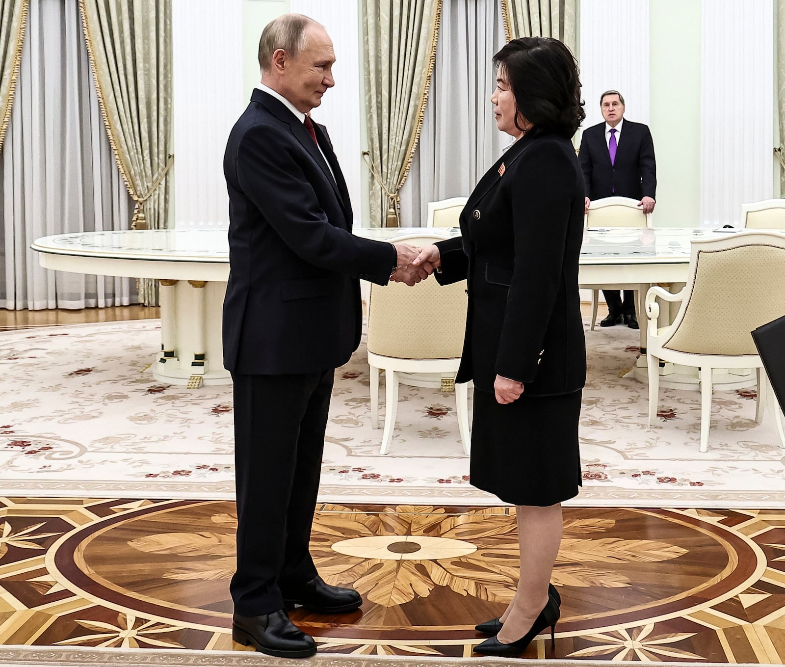 Russian President Vladimir Putin greets North Korean Foreign Minister Choe Son Hui during their meeting at the Kremlin in Moscow, Russia, Monday, Nov. 4, 2024. (Mikhail Tereshchenko, Sputnik, Kremlin Pool Photo via AP)