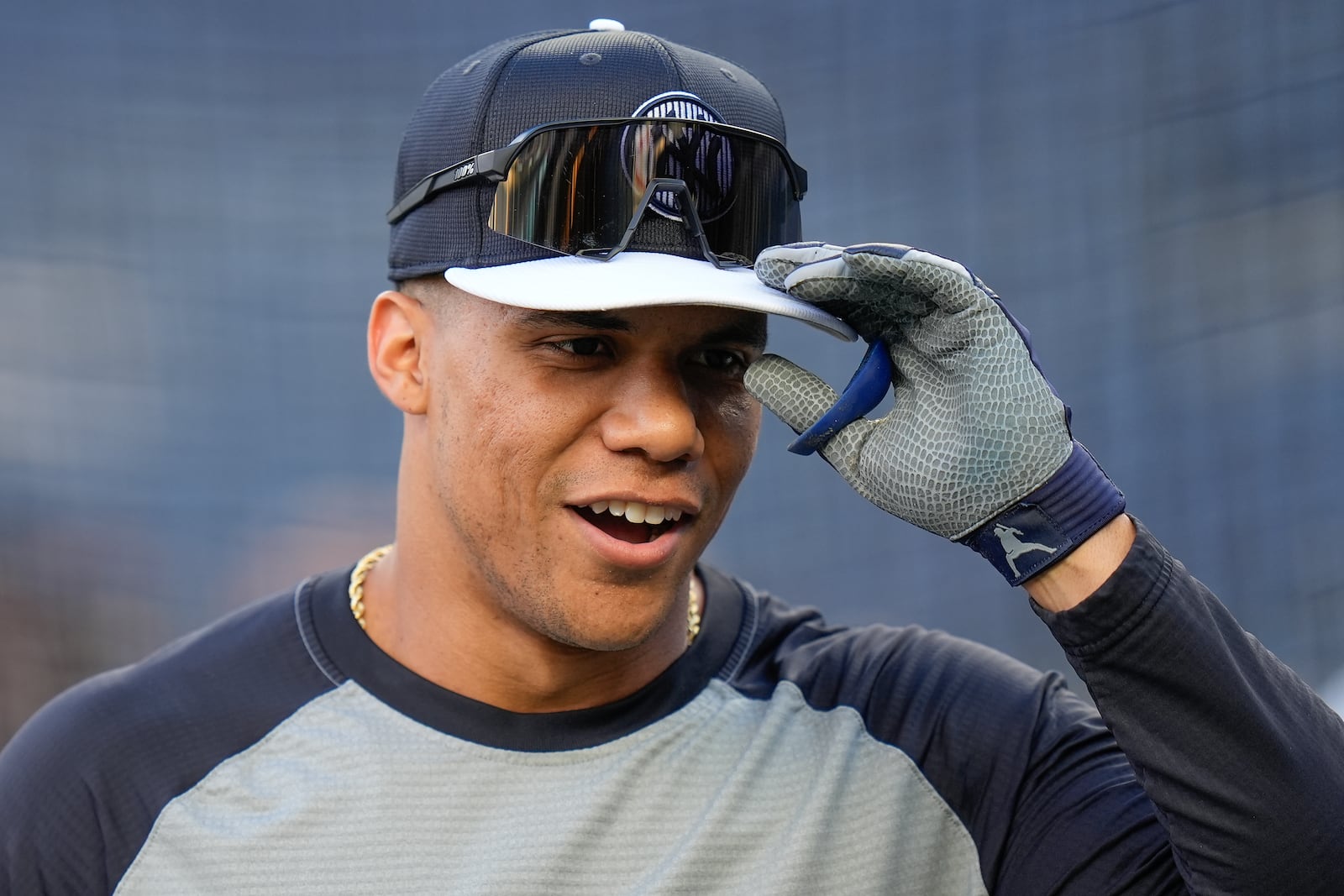 New York Yankees outfielder Juan Soto (22) warms up before playing against the Kansas City Royals in Game 2 of the American League baseball playoff series, Monday, Oct. 7, 2024, in New York. (AP Photo/Seth Wenig)