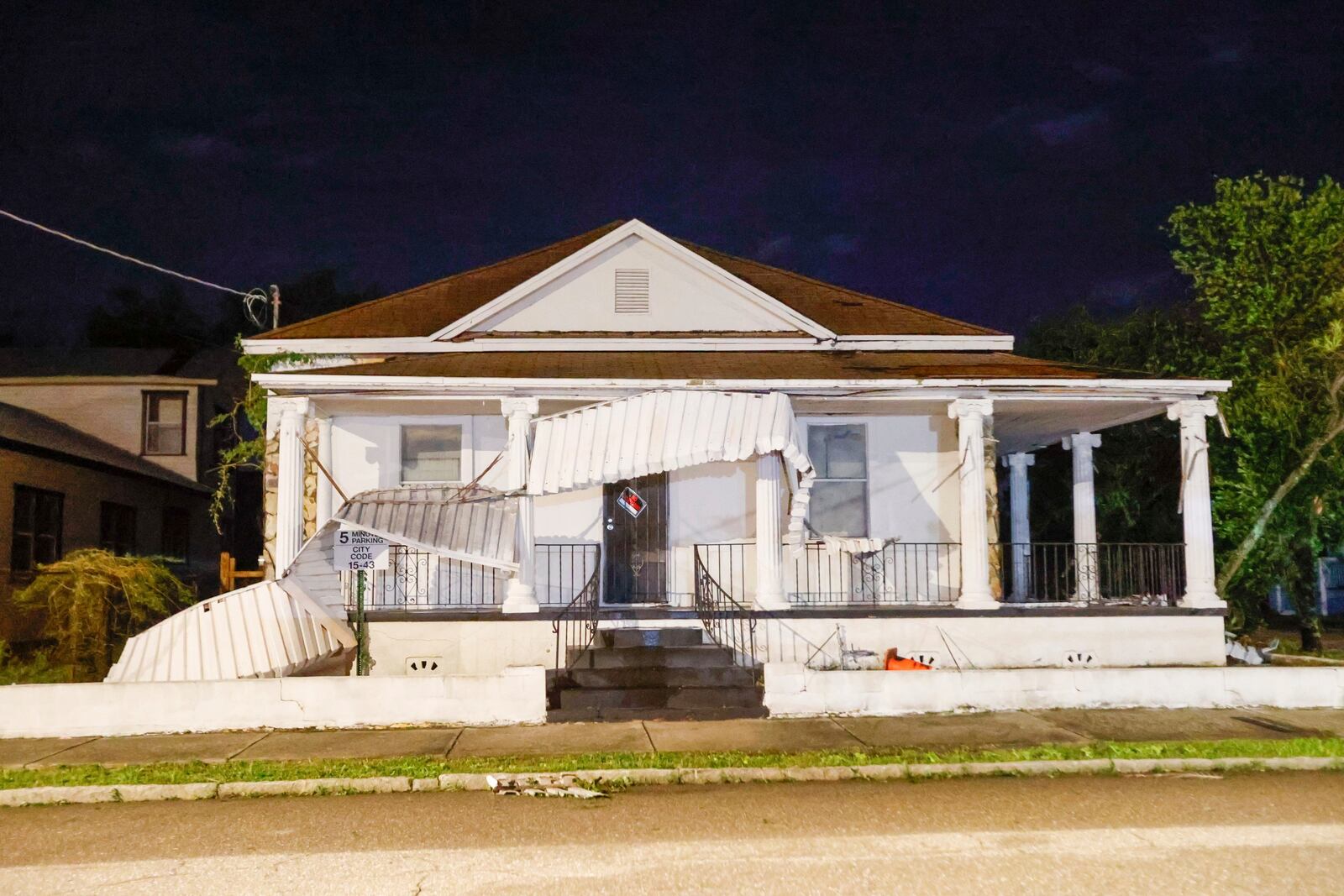 A house loses its awning after Hurricane Milton on Thursday, Oct. 10, 2024, in Tampa. (Jefferee Woo/Tampa Bay Times via AP)