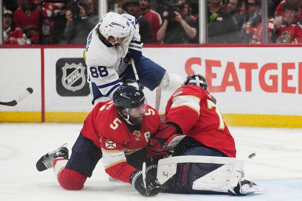 Florida Panthers defenseman Aaron Ekblad (5) and goaltender Sergei Bobrovsky, right, defend the goal against Toronto Maple Leafs right wing William Nylander (88) during the second period in Game 6 of a second-round NHL hockey playoff series, Friday, May 16, 2025, in Sunrise, Fla. (AP Photo/Lynne Sladky)