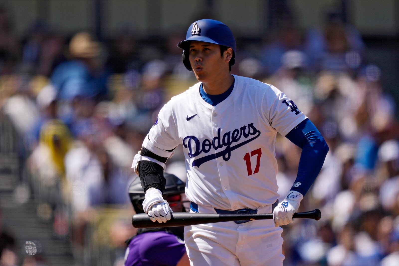 Los Angeles Dodgers' Shohei Ohtani reacts to taking a strike during the first inning of a baseball game against the Colorado Rockies, Sunday, Sept. 22, 2024, in Los Angeles. (AP Photo/Mark J. Terrill)