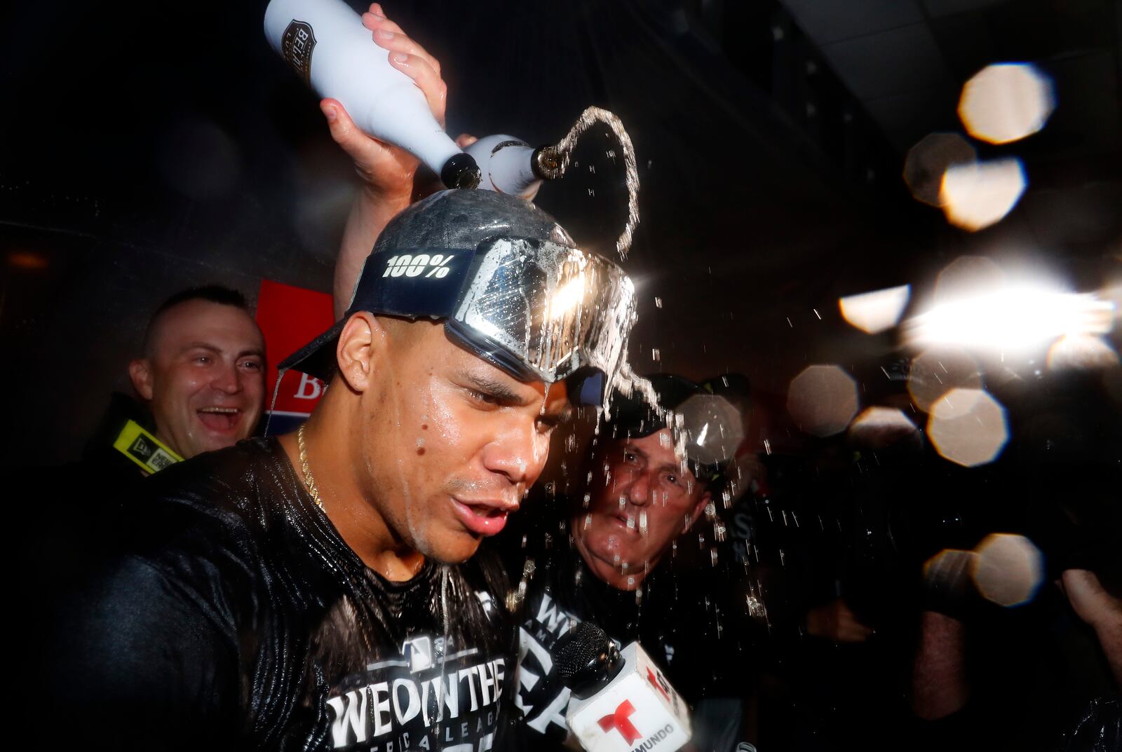 New York Yankees' Juan Soto celebrates with teammates after clinching the American League East title in a baseball game against the Baltimore Orioles, Thursday, Sept. 26, 2024, in New York. (AP Photo/Noah K. Murray)