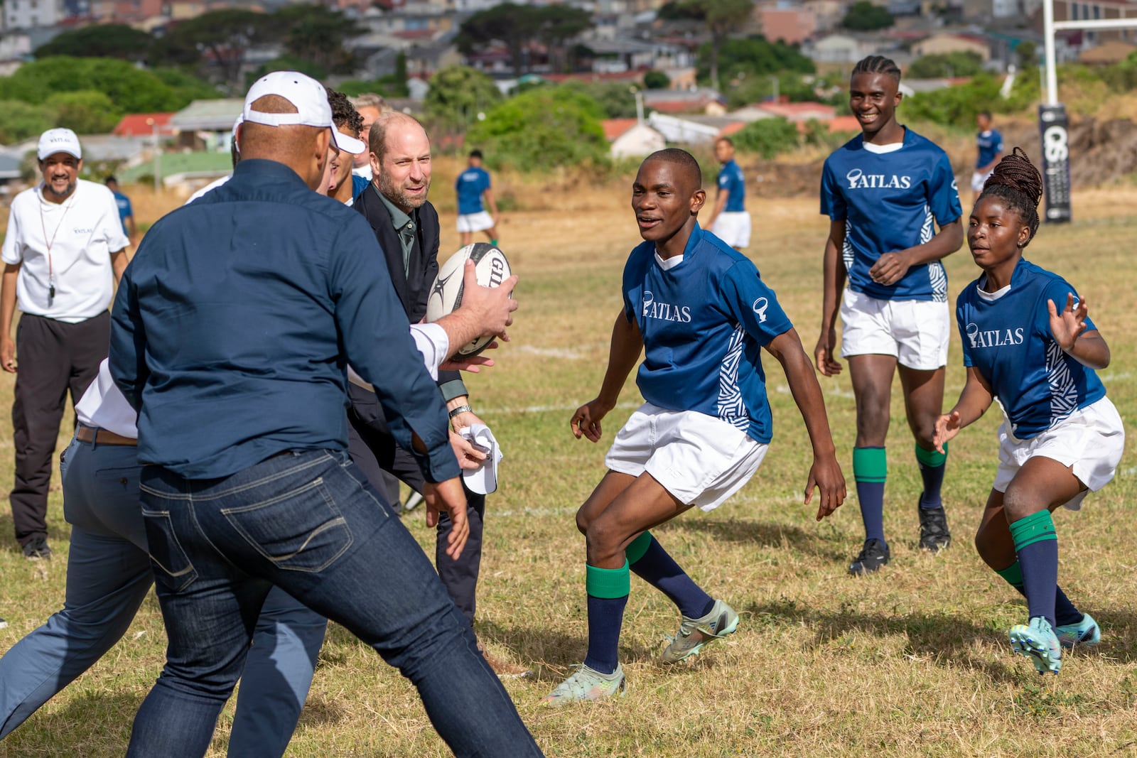 Britain's Prince William plays rugby with pupils at the Ocean View Secondary School in Cape Town, South Africa, Monday, Nov. 4, 2024. (AP Photo/Jerome Delay-pool)