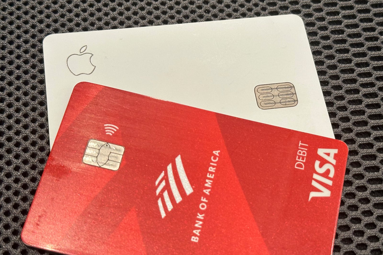 An Apple credit card is shown with a Visa debit card in a photo taken in New York on Tuesday, Sept. 24, 2024. (AP Photo/Peter Morgan)