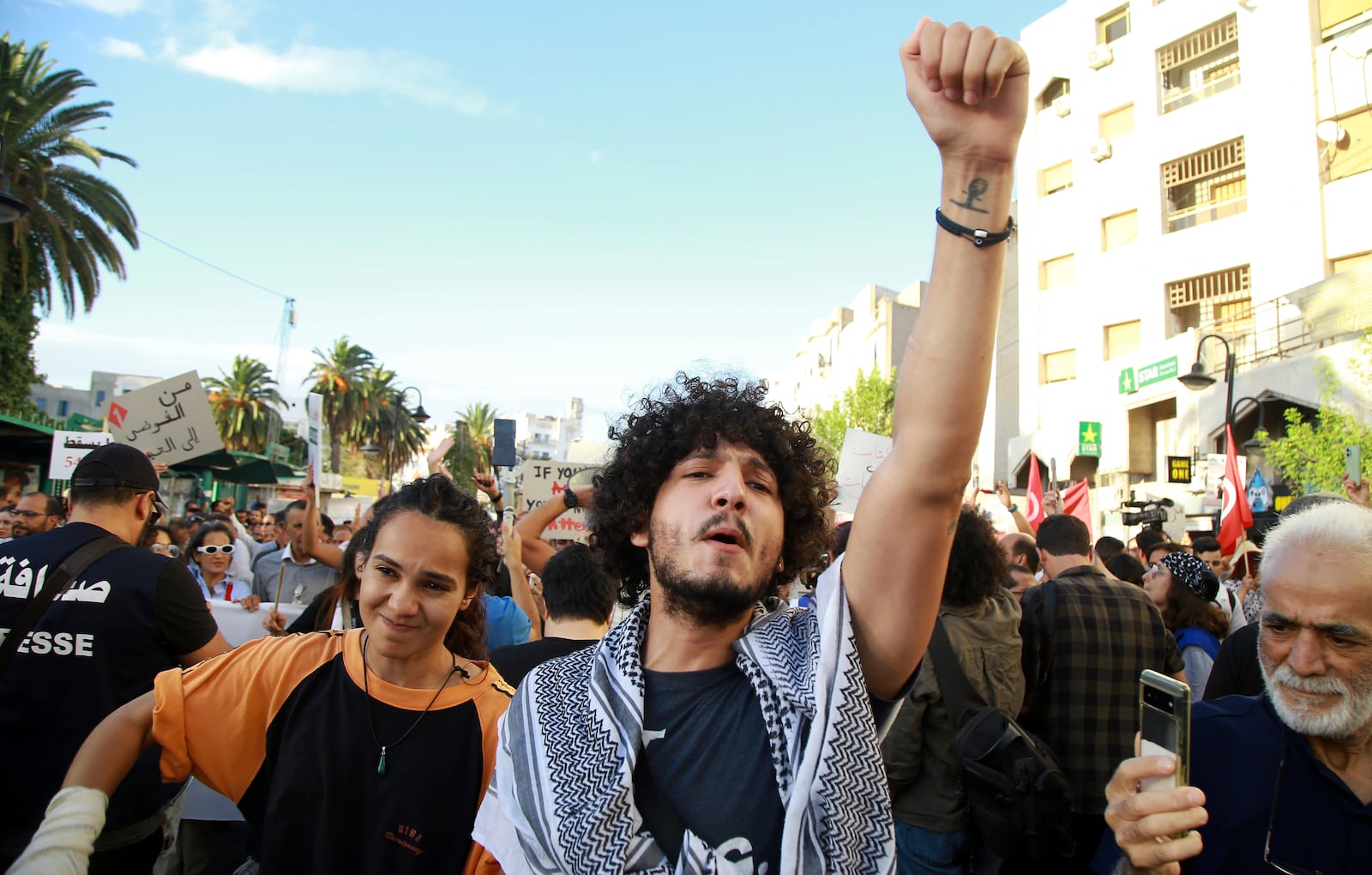 Tunisian take part in a protest against President Kais Saied ahead of the upcoming presidential elections, Friday, Sept. 13, 2024, on Avenue Habib Bourguiba in the capital Tunis.(AP Photo/Anis Mili)