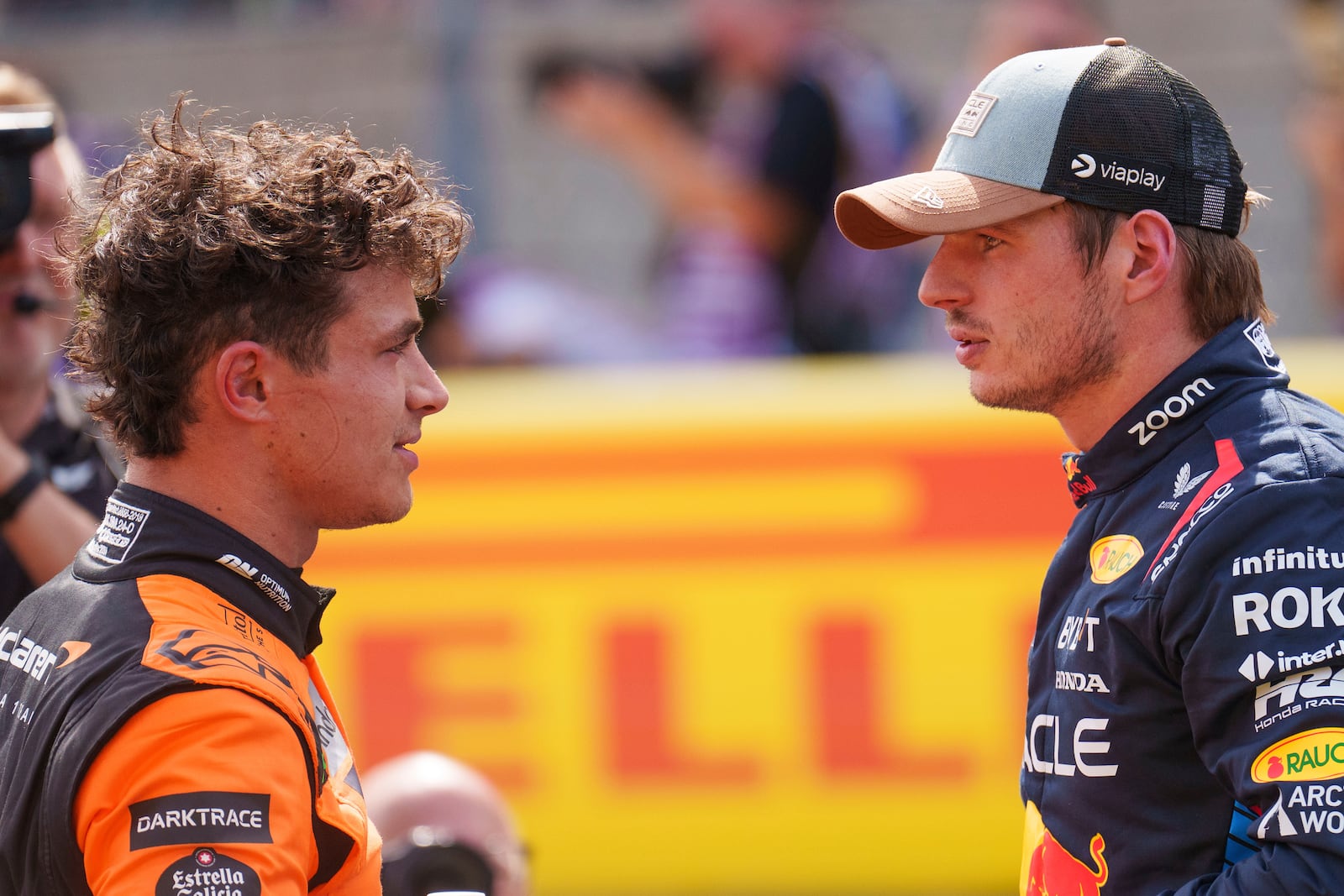 McLaren driver Lando Norris, of Britain, left, talks with Red Bull driver Max Verstappen, of the Netherlands, right, after the sprint race ahead of the Formula One U.S. Grand Prix auto race at Circuit of the Americas, Saturday, Oct. 19, 2024, in Austin, Texas. (AP Photo/Nick DIdlick)