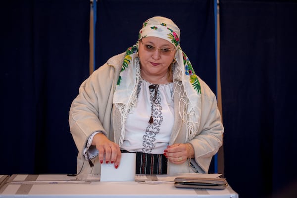 Diana Iovanovici-Sosoaca, the leader of the S.O.S. Romania party and member of European Parliament casts her vote in the country's parliamentary elections, in Bucharest, Romania, Sunday, Dec. 1, 2024. (AP Photo/Andreea Alexandru)