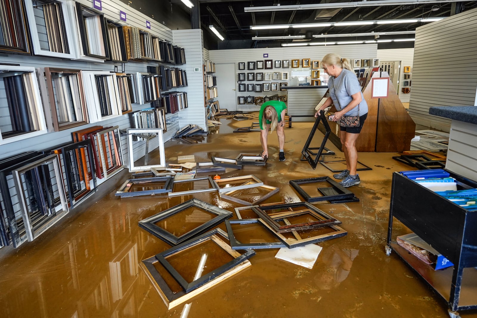 Flood water from Hurricane Helene damaged International Moulding, a frame shop on North Green Street, Monday, Sept. 30, 2024, in Morganton, N.C. (AP Photo/Kathy Kmonicek)