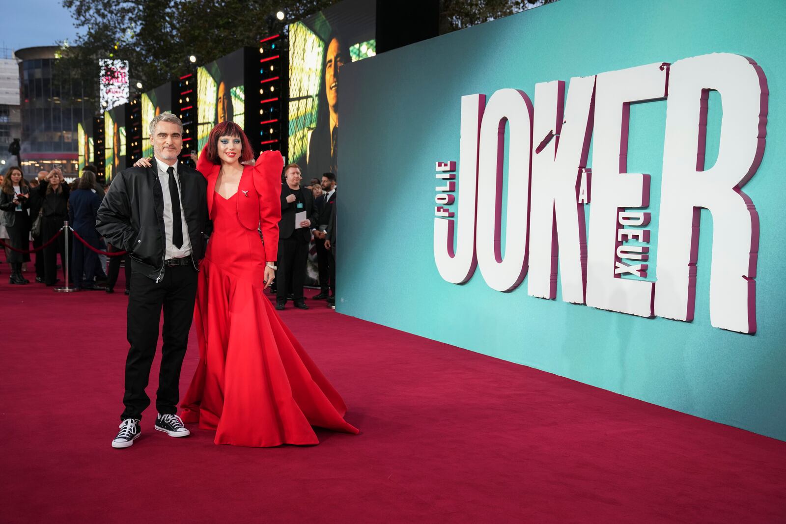 Joaquin Phoenix, left, and Lady Gaga pose for photographers upon arrival at the premiere for the film 'Joker: Folie A Deux' on Wednesday, Sept. 25, 2024, in London. (Photo by Scott A Garfitt/Invision/AP)