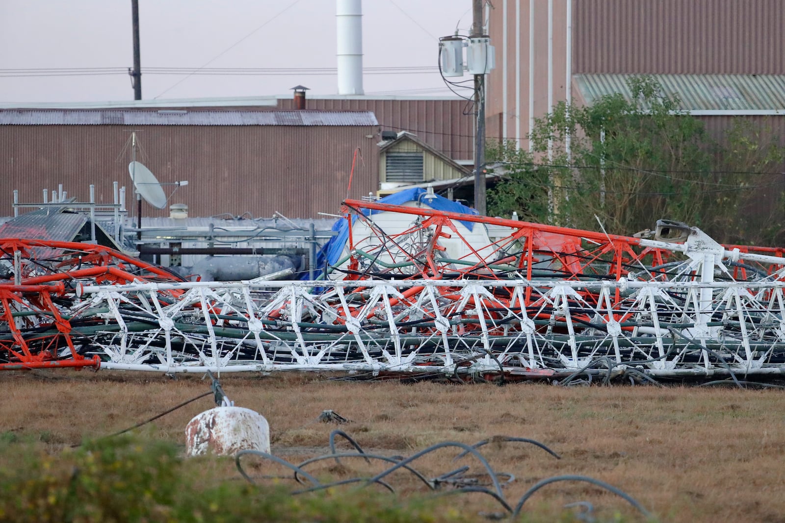 A view from the north side of the collapsed radio tower where a helicopter collided with the structure, killing all aboard Monday, Oct. 21, 2024 in Houston. (Michael Wyke/Houston Chronicle via AP)