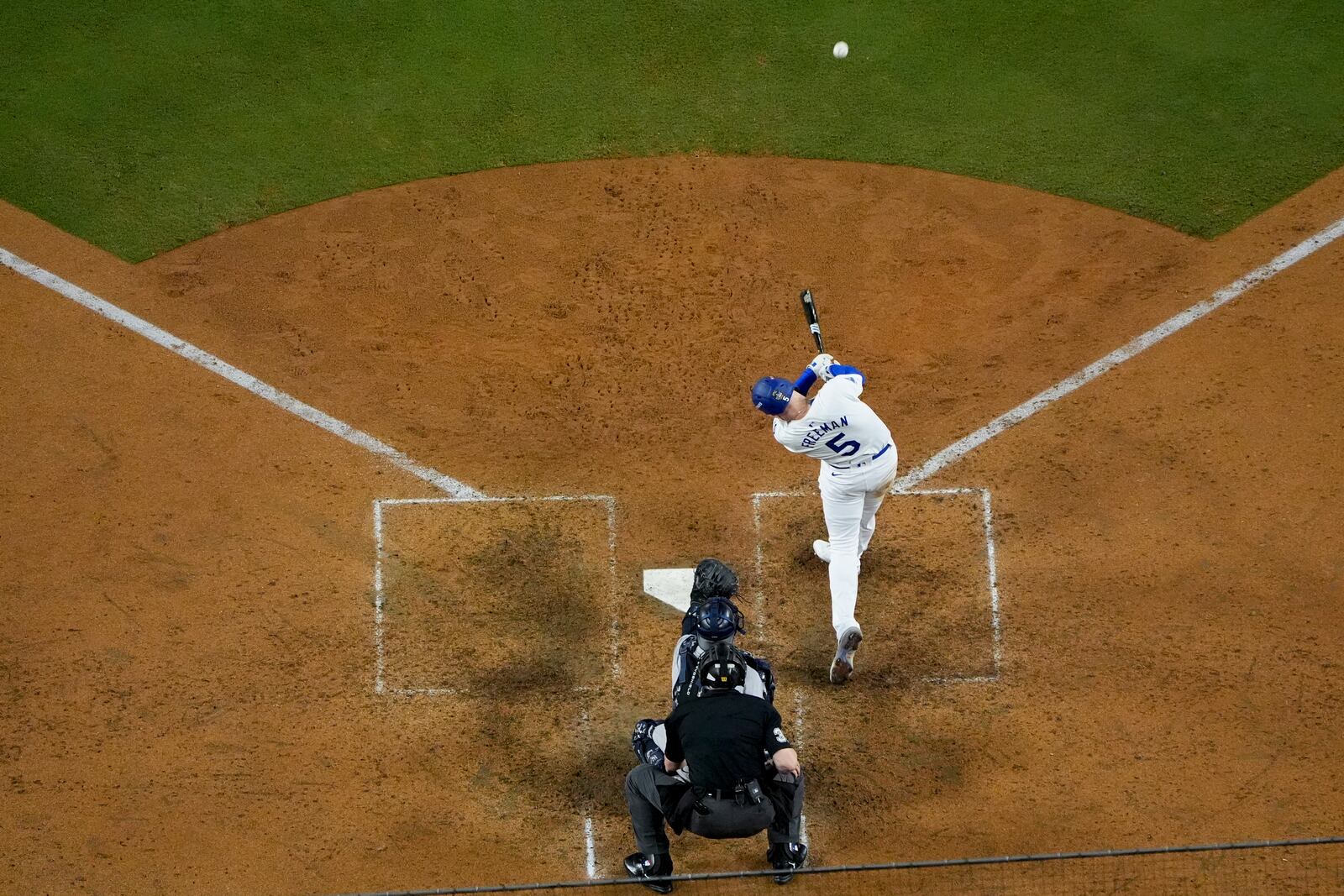 Los Angeles Dodgers' Freddie Freeman connects for a walk-off grand slam home run during the 10th inning in Game 1 of the baseball World Series against the New York Yankees, Friday, Oct. 25, 2024, in Los Angeles. (AP Photo/Mark J. Terrill)