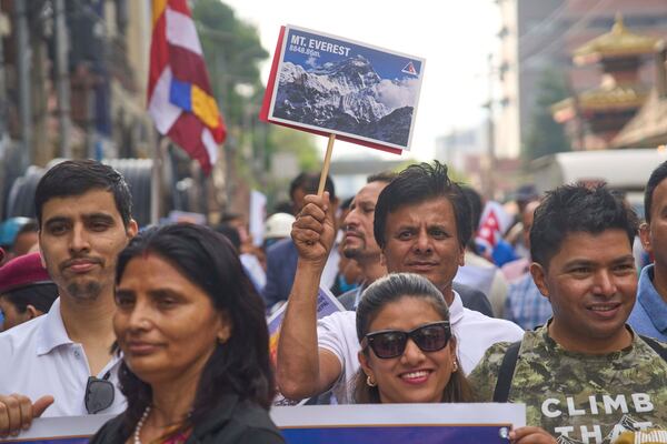 People from the mountaineering community participate in a rally to mark the anniversary of the first ascent of Mount Everest in Kathmandu, Nepal, Thursday, May 29, 2025. (AP Photo/Niranjan Shrestha)