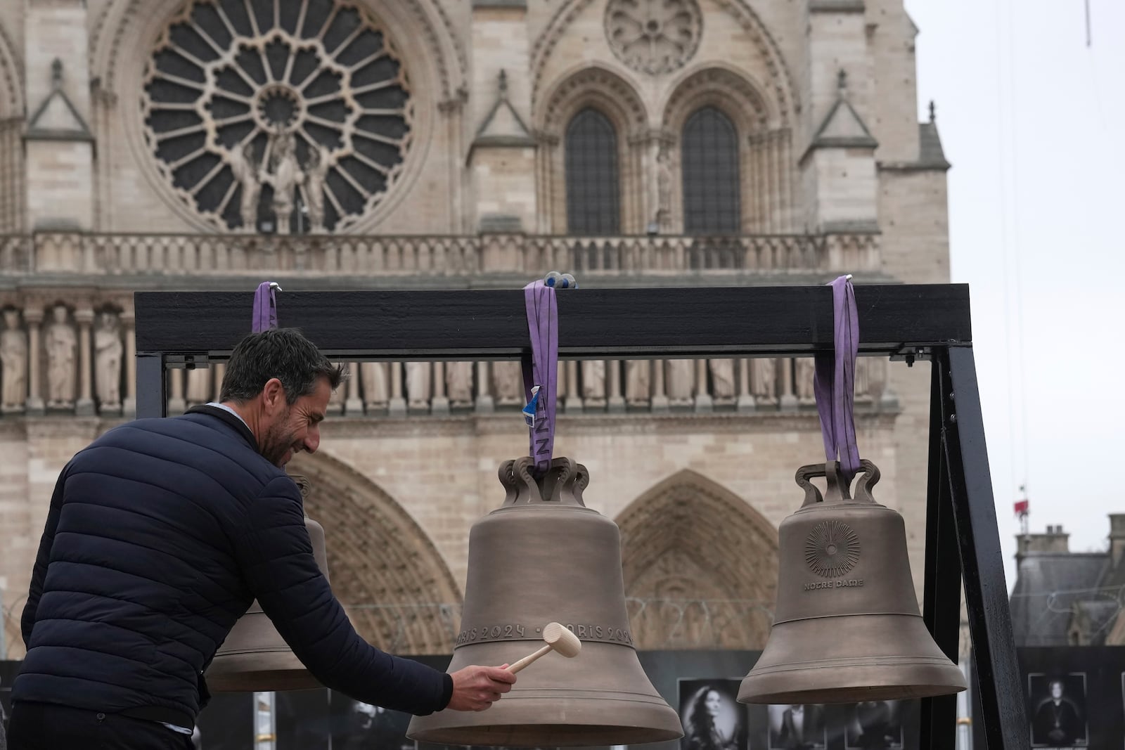 Tony Estanguet, head of Paris 2024 Olympic Games, rings the bell that Olympic medalists rang at the Paris Games, before its installation in Notre-Dame cathedral, ahead of the monument's grandiose reopening following a massive fire and five-year reconstruction effort, Thursday, Nov. 7, 2024 in Paris. (AP Photo/Christophe Ena)