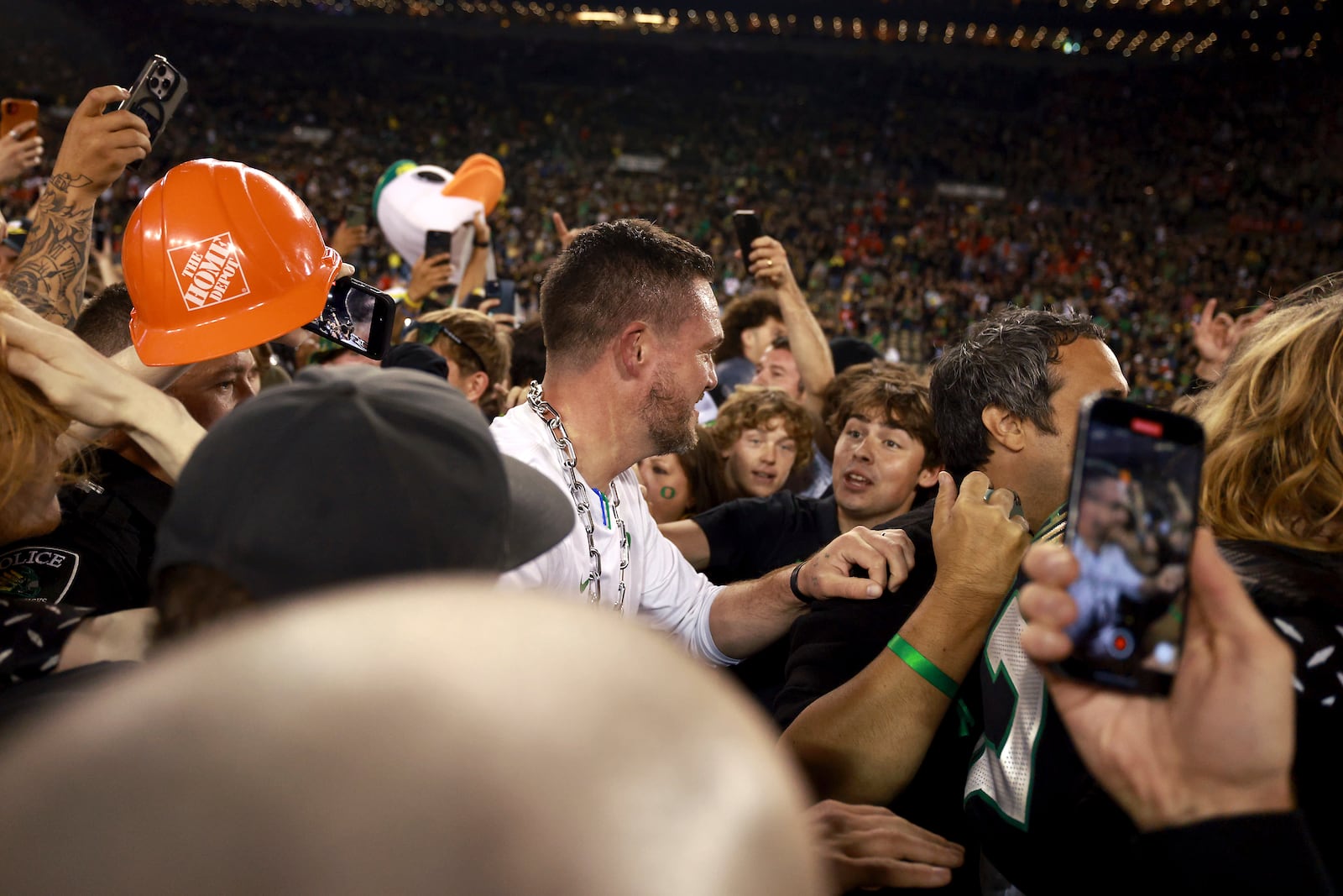 Oregon head coach Dan Lanning celebrates with fans after the team won against Ohio State in an NCAA college football game, Saturday, Oct. 12, 2024, at Autzen Stadium in Eugene, Ore. (AP Photo/Lydia Ely)