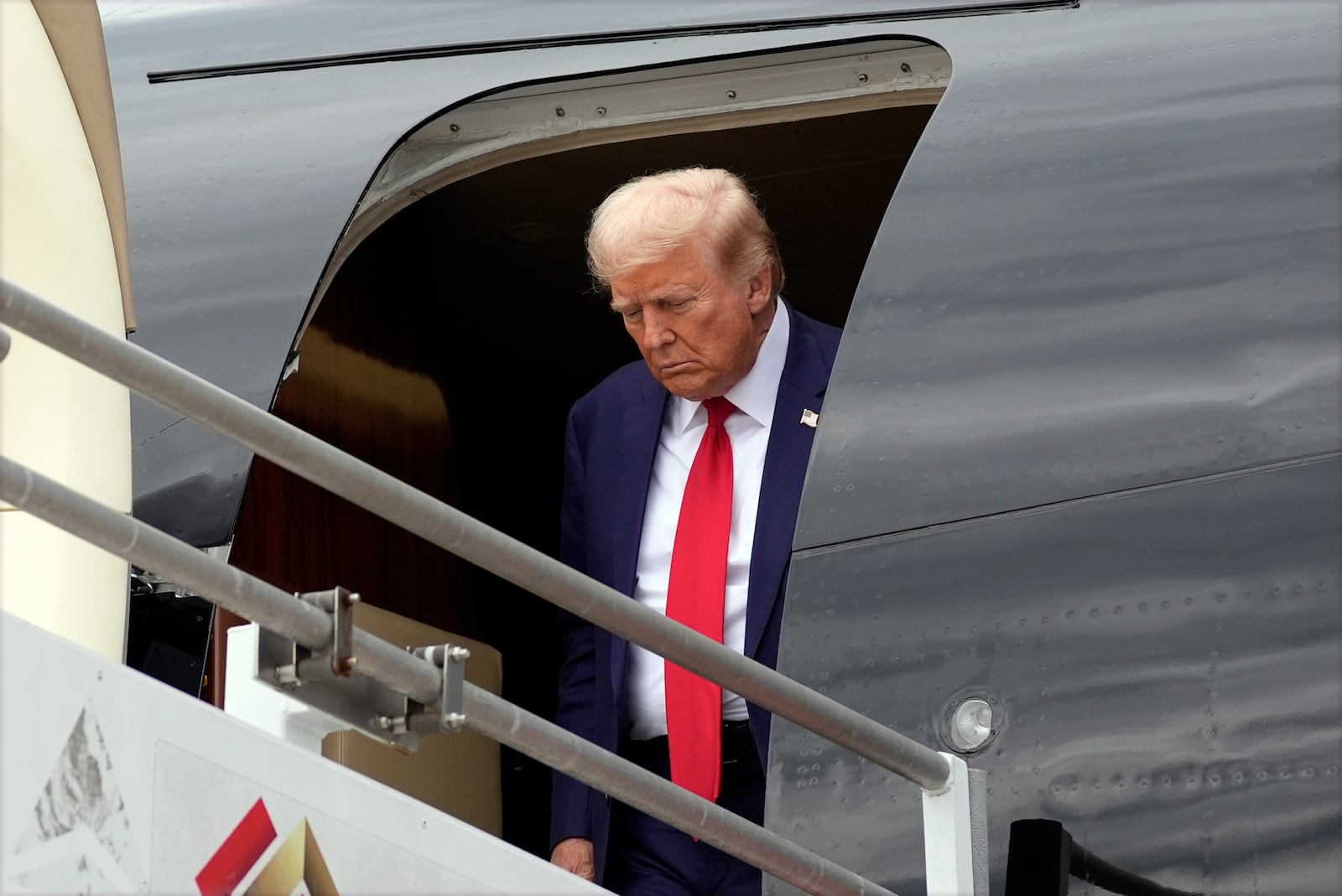 Republican presidential nominee former President Donald Trump arrives at Augusta Regional Airport to visit areas impacted by Hurricane Helene, Friday, Oct. 4, 2024, in Augusta, Ga. (AP Photo/Evan Vucci)