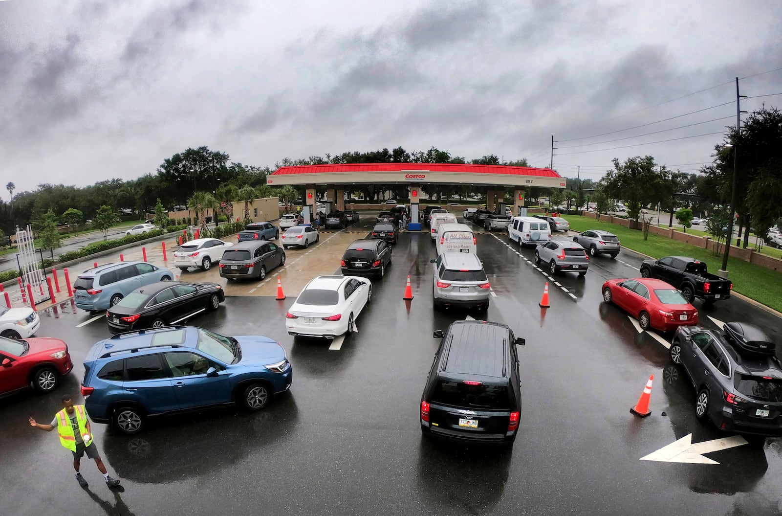 Cars wait in line to get into the parking lot for gas at Costco, Monday, Oct. 7, 2024, in Altamonte Springs, Fla., as residents prepare for the impact of approaching Hurricane Milton. (Joe Burbank/Orlando Sentinel via AP)