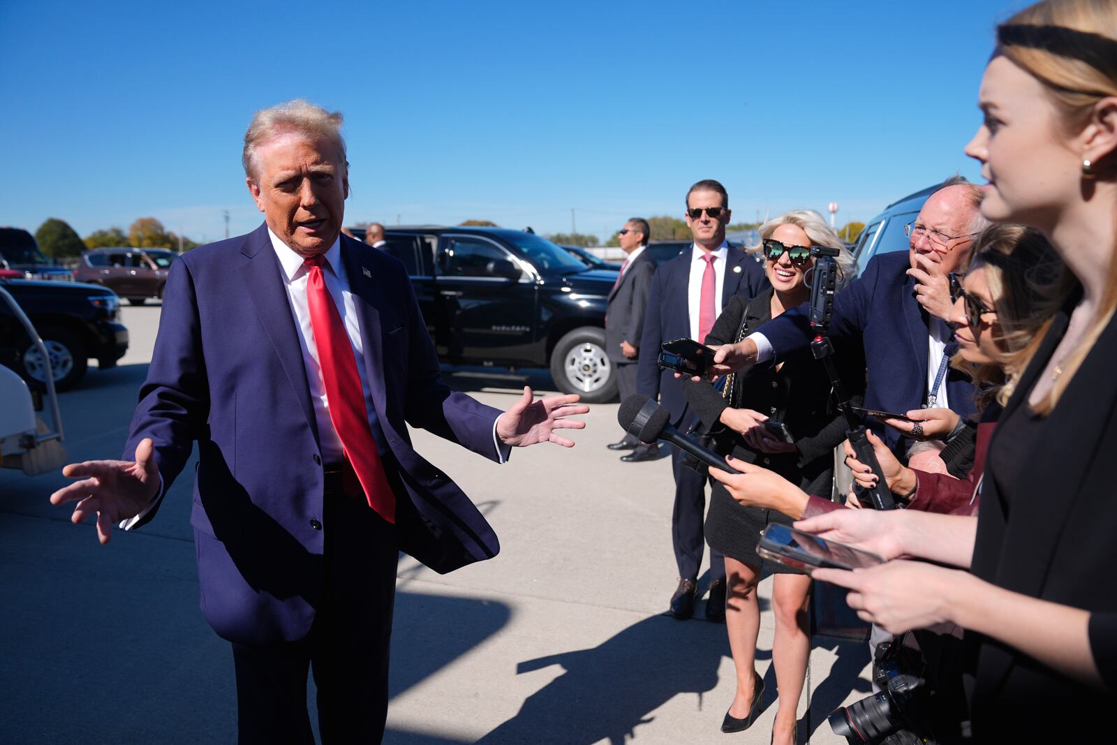 Republican presidential nominee former President Donald Trump speaks with reporters upon arrival at Philadelphia International Airport, Sunday, Oct. 20, 2024, in Philadelphia. (AP Photo/Evan Vucci)