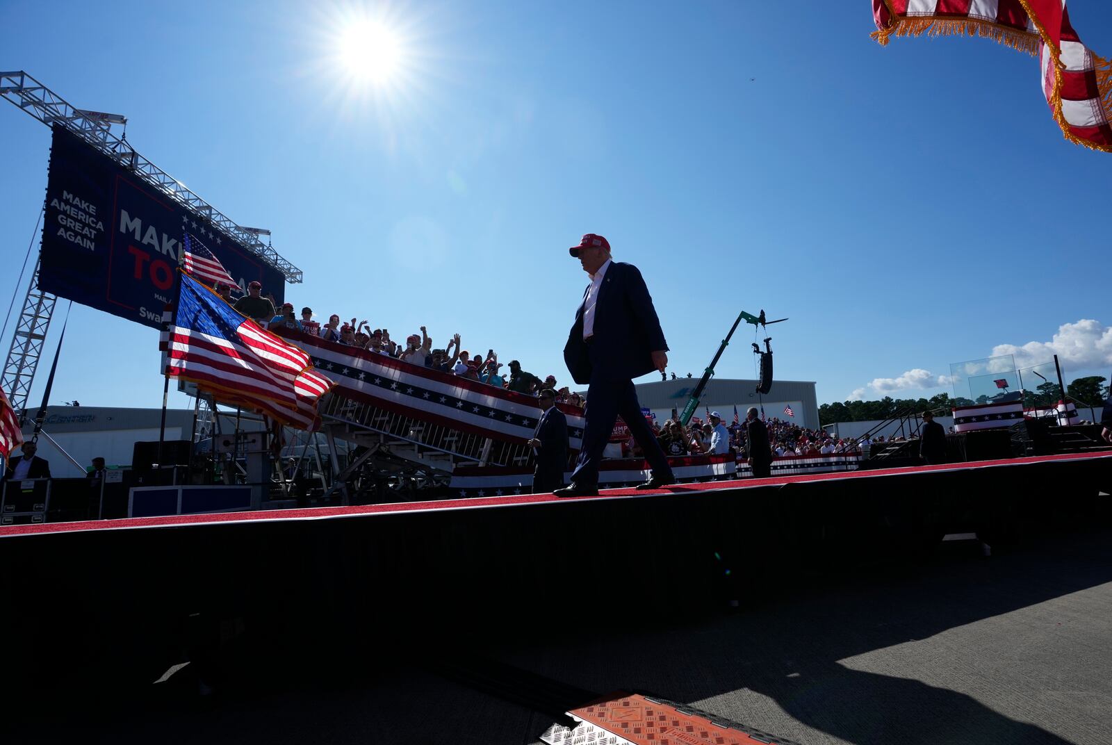 Republican presidential nominee former President Donald Trump walks from the stage after speaking at a campaign rally at Wilmington International Airport, Saturday, Sept. 21, 2024, in Wilmington, N.C. (AP Photo/Alex Brandon)