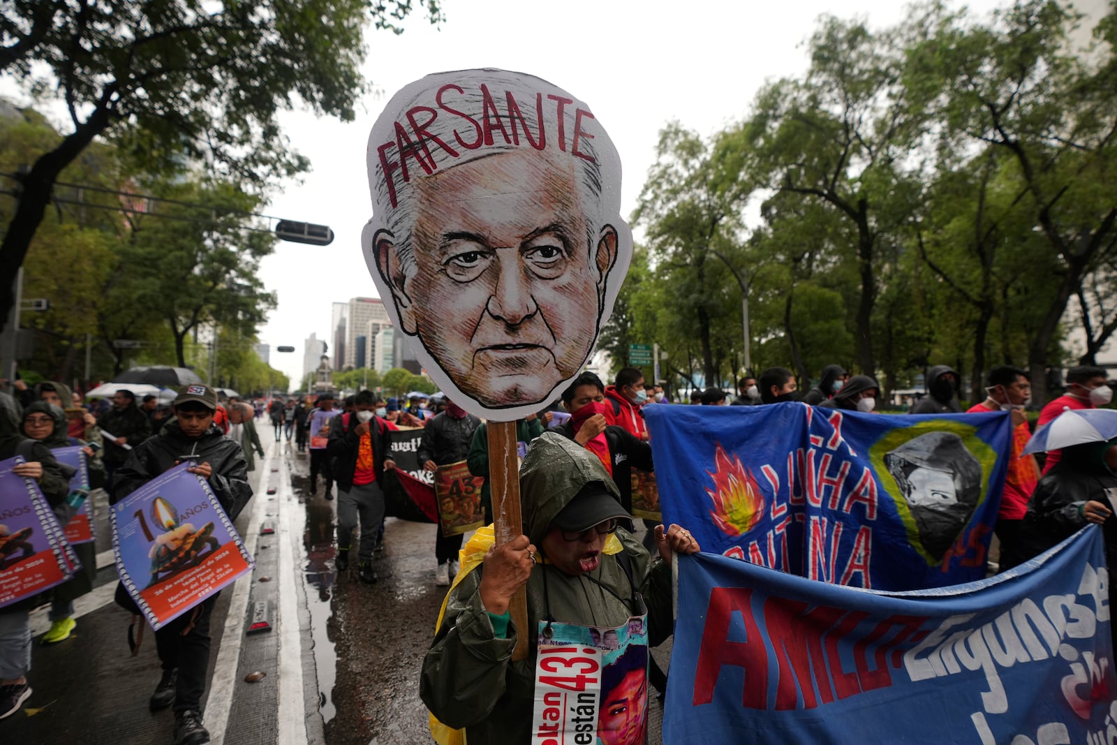 Families and friends take part in a demonstration marking the 10-year anniversary of the disappearance of 43 students from an Ayotzinapa rural teacher's college, in Mexico City, Thursday, Sept. 26, 2024. (AP Photo/Fernando Llano)