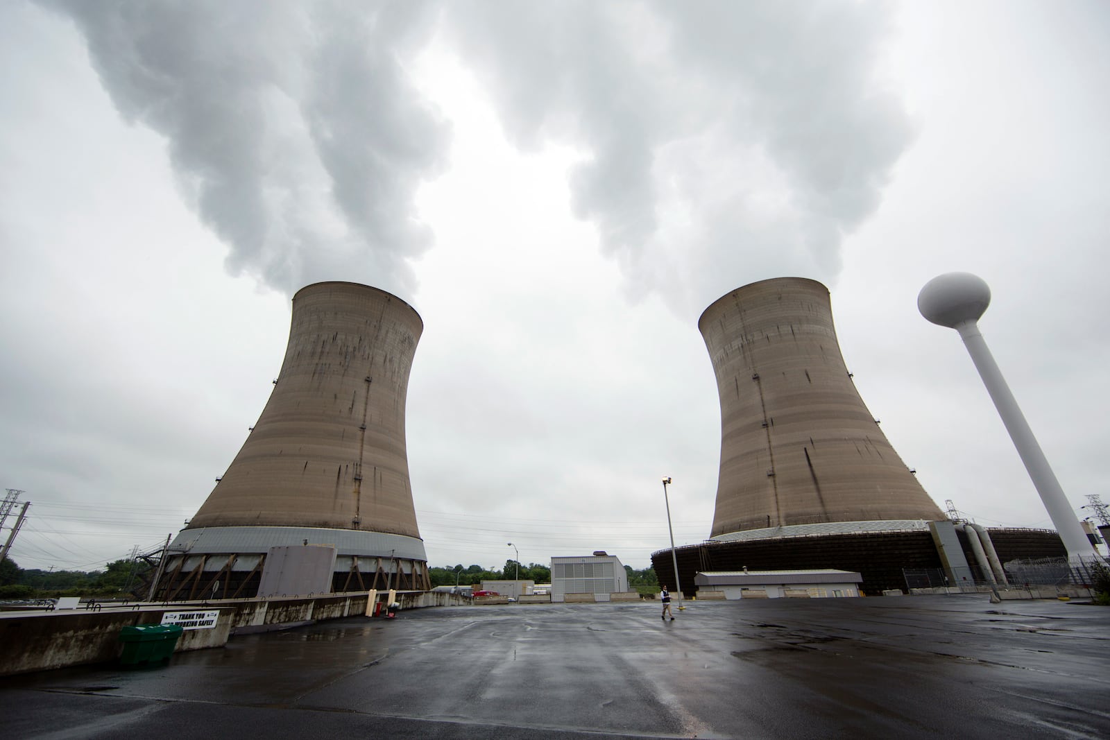 FILE - This May 22, 2017 file photo, shows cooling towers at the Three Mile Island nuclear power plant in Middletown, Pa. (AP Photo/Matt Rourke, File)