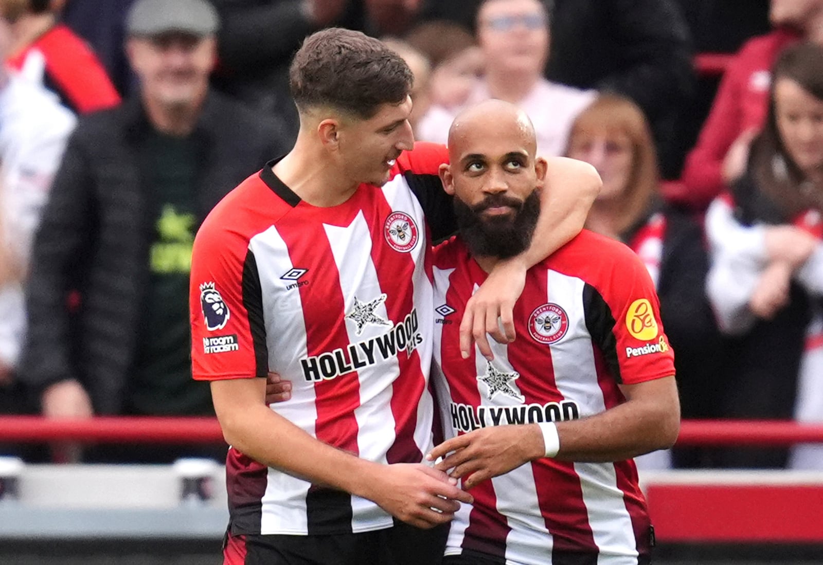 Brentford's Bryan Mbeumo, right, celebrates scoring his side's third goal of the game, during the English Premier League soccer match between Brentford and Ipswich Town, at the Gtech Community Stadium, in London, Saturday, Oct. 26, 2024. (John Walton/PA via AP)