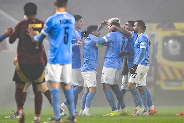 Israel's Yarden Shua, centre right, celebrates after scoring his side's opening goal during the UEFA Nations League Group A2 soccer match between Israel and Belgium at the Bozsik Arena stadium in Budapest, Hungary, Sunday, Nov. 17, 2024. (AP Photo/Denes Erdos)