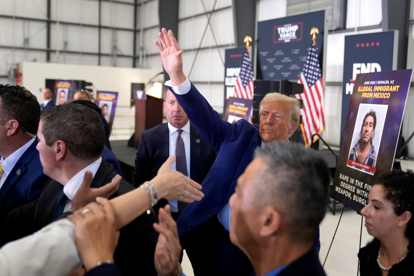 Republican presidential nominee former President Donald Trump waves as he greets attendees upon departs a news conference at Austin-Bergstrom International Airport, Friday, Oct. 25, 2024, in Austin, Texas. (AP Photo/Alex Brandon)