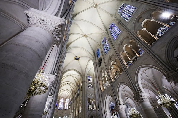 The nave of Notre-Dame de Paris cathedral is seen while French President Emmanuel Macron visits the restored interiors of the cathedral, Friday Nov. 29, 2024, in Paris. (Stephane de Sakutin, Pool via AP)