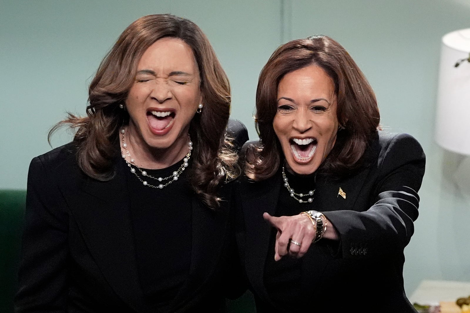 Democratic presidential nominee Vice President Kamala Harris appears on NBC's "Saturday Night Live," with Maya Rudolph, Saturday, Nov. 2, 2024 in New York. Harris has made an unannounced trip to New York to appear briefly stepping away from the battleground states she's been campaigning in with just three days to go before the election. (AP Photo/Jacquelyn Martin)