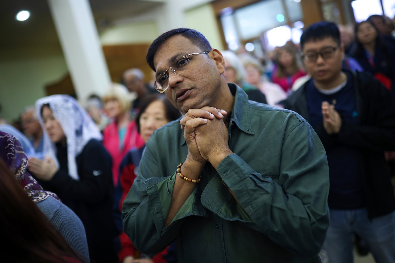 Pilgrims say their prayers inside the St. James Church in Medjugorje, Bosnia, Thursday, Sept. 19, 2024. (AP Photo/Armin Durgut)