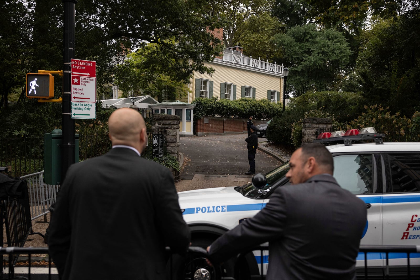 Police officers stand outside Gracie Mansion, the official residence of New York City Mayor Eric Adams, Thursday, Sep. 26, 2024, in New York. (AP Photo/Yuki Iwamura)