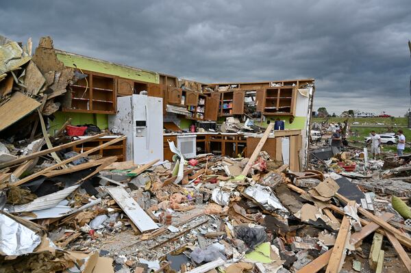 The remains of a kitchen surrounded by debris after severe storms in the Sunshine Hills neighborhood in London, Ky., Monday, May 19, 2025. (AP Photo/Timothy D. Easley)