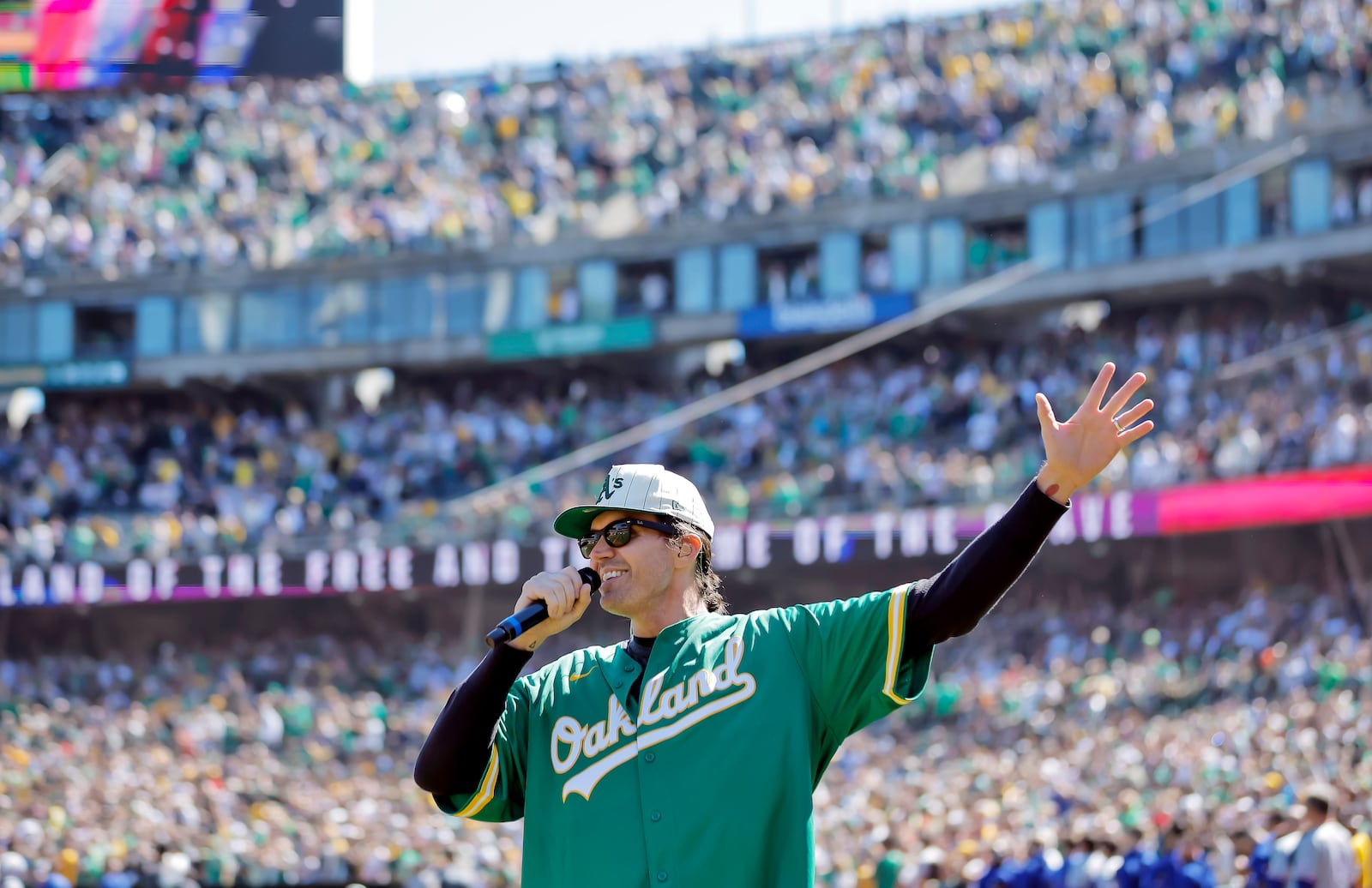 FILE - Former Oakland Athetics pitcher Barry Zito sings the national anthem before the Athletics play the Texas Rangers in Oakland, Calif., Sept. 26, 2024. (Carlos Avila Gonzalez/San Francisco Chronicle via AP, File)